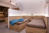 A bed or beds in a room at Apartments Pragser Wildsee Winklwiese