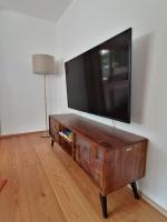 Telewizja i/lub zestaw kina domowego w obiekcie Living Apart Haslwanter Ferienwohnung