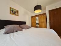 Postel nebo postele na pokoji v ubytování Pirin Golf Apartment HOME with private garden