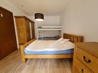 Postel nebo postele na pokoji v ubytování Pirin Golf Apartment HOME with private garden
