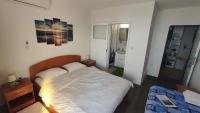 Posteľ alebo postele v izbe v ubytovaní Guesthouse Podaca