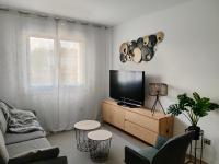A television and/or entertainment centre at Second Home Arzúa apartamentos