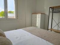 A bed or beds in a room at Second Home Arzúa apartamentos