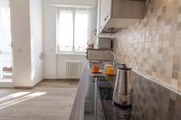 Kuchyňa alebo kuchynka v ubytovaní Mamma Ciccia Holiday Home - Casa Imperia