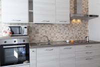Kuchyňa alebo kuchynka v ubytovaní Mamma Ciccia Holiday Home - Casa Imperia