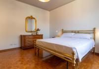 Posteľ alebo postele v izbe v ubytovaní Mamma Ciccia Holiday Home - Casa Imperia
