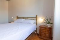 Posteľ alebo postele v izbe v ubytovaní Mamma Ciccia Holiday Home - Casa Imperia