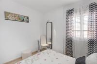 A bed or beds in a room at Apartamento Porís
