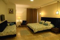 Postel nebo postele na pokoji v ubytování Larimar Hôtel Sfax