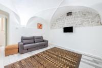 Televízia a/alebo spoločenská miestnosť v ubytovaní Il Golfo Apartments Duplex
