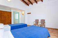 Łóżko lub łóżka w pokoju w obiekcie Hostal Marina