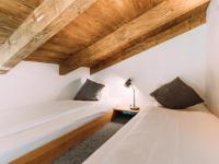 Łóżko lub łóżka w pokoju w obiekcie Tauern Lodge XL