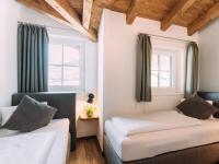 Łóżko lub łóżka w pokoju w obiekcie Tauern Lodge XL