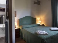 Posteľ alebo postele v izbe v ubytovaní Belvilla by OYO Serene Apartment with Garden