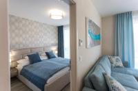 Posteľ alebo postele v izbe v ubytovaní Coral Luxury Apartment