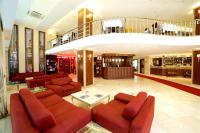 a lobby with couches and a staircase in a building at Mosaic Hotel Old City -Special Category in Istanbul