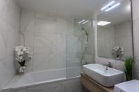Kúpeľňa v ubytovaní Coral Luxury Apartment