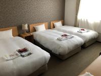 SUN PLAZA HOTEL 富士山中湖にあるベッド