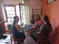a group of three women sitting at a table at DeKotzenhof in Wakkerstroom