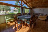 a dining room with a table and chairs at Au Temps Suspendu in Saint-Martin-dʼOydes