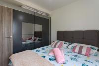 Postel nebo postele na pokoji v ubytování Apartman Nikol