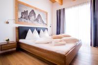 Posteľ alebo postele v izbe v ubytovaní Apartments Dolomit-Royal