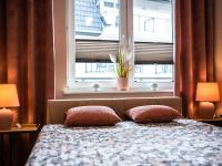 Posteľ alebo postele v izbe v ubytovaní Markowe Apartamenty Złoty Park