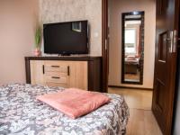 Televízia a/alebo spoločenská miestnosť v ubytovaní Markowe Apartamenty Złoty Park