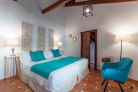 Posteľ alebo postele v izbe v ubytovaní SUITES CASA DE LAS COLUMNAS