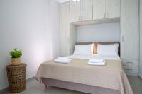 A bed or beds in a room at The Lefkadian collection G and N
