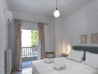 Posteľ alebo postele v izbe v ubytovaní Newly Renovated Apartment in the Heart of Athens