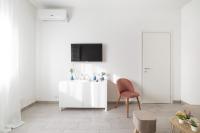 Televízia a/alebo spoločenská miestnosť v ubytovaní Piazza Tripoli bright apartment