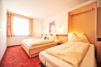 Łóżko lub łóżka w pokoju w obiekcie Appartements Plattlerhof