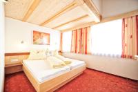 Łóżko lub łóżka w pokoju w obiekcie Appartements Plattlerhof