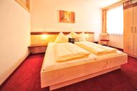 Łóżko lub łóżka w pokoju w obiekcie Appartements Plattlerhof