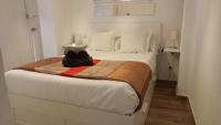 Posteľ alebo postele v izbe v ubytovaní Holidays2Malaga Velarde cerca Hospital Civil y Centro Malaga