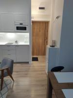 Kuchyňa alebo kuchynka v ubytovaní Apartament FANABERIA Lądek Zdrój