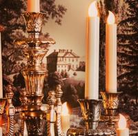 a group of candles sitting on top of a table at Moffat House in Moffat
