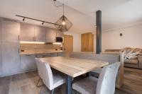 A kitchen or kitchenette at Apartments Pragser Wildsee Winklwiese