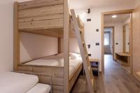 A bed or beds in a room at Apartments Pragser Wildsee Winklwiese
