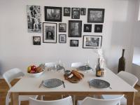 a dining room table with plates and fruit on it at La Maison du Quai Triplex de charme 4 étoiles en hyper centre avec SPA in Landerneau