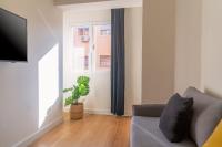 Televízia a/alebo spoločenská miestnosť v ubytovaní Vibe Apartments by Olala Homes