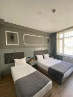Postel nebo postele na pokoji v ubytování Ortakoy Aysem Sultan Hotel