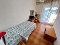 A bed or beds in a room at Hotel Ca' Bianca da Paolino