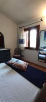 Łóżko lub łóżka w pokoju w obiekcie Villa Janas con piscina privata Budoni