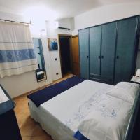 Łóżko lub łóżka w pokoju w obiekcie Villa Janas con piscina privata Budoni