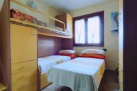 Łóżko lub łóżka w pokoju w obiekcie Villa Janas con piscina privata Budoni