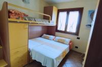 Łóżko lub łóżka w pokoju w obiekcie Villa Janas con piscina privata Budoni