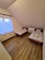 Posteľ alebo postele v izbe v ubytovaní Ośrodek Wypoczynkowo Sportowy Pod Żurawiem Apt. 2