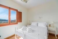 Posteľ alebo postele v izbe v ubytovaní SUN VILLA GLYFADA